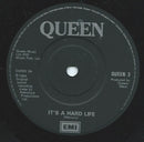Queen : It's A Hard Life (7", Bla)