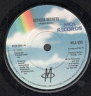 M (2) : Official Secrets (7", Single)