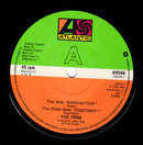 The Firm (7) : Radioactive (7", Single, Pap)