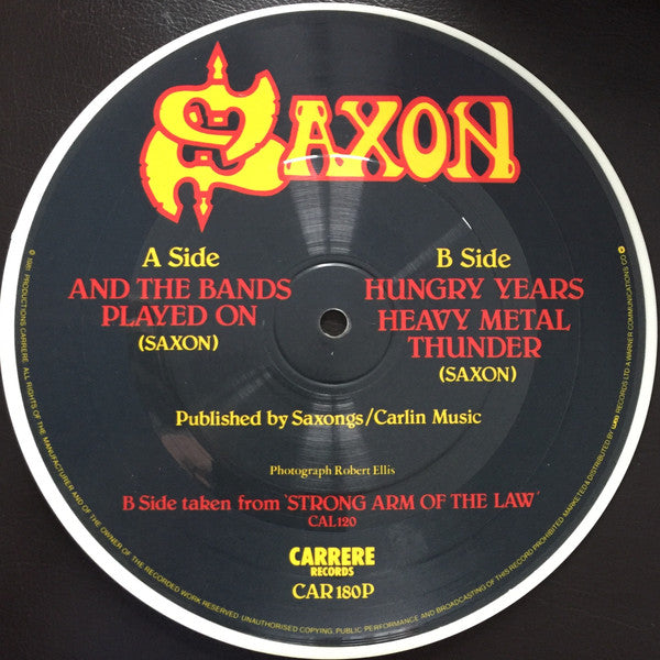 Saxon : And The Bands Played On (7", Single, Pic, Whi)