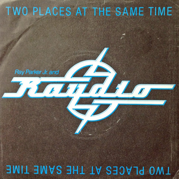 Raydio : Two Places At The Same Time (7", Single)
