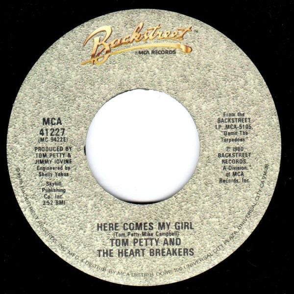 Tom Petty And The Heartbreakers : Here Comes My Girl (B/W) Louisiana Rain (7", Single, Glo)