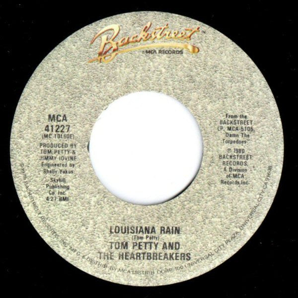 Tom Petty And The Heartbreakers : Here Comes My Girl (B/W) Louisiana Rain (7", Single, Glo)