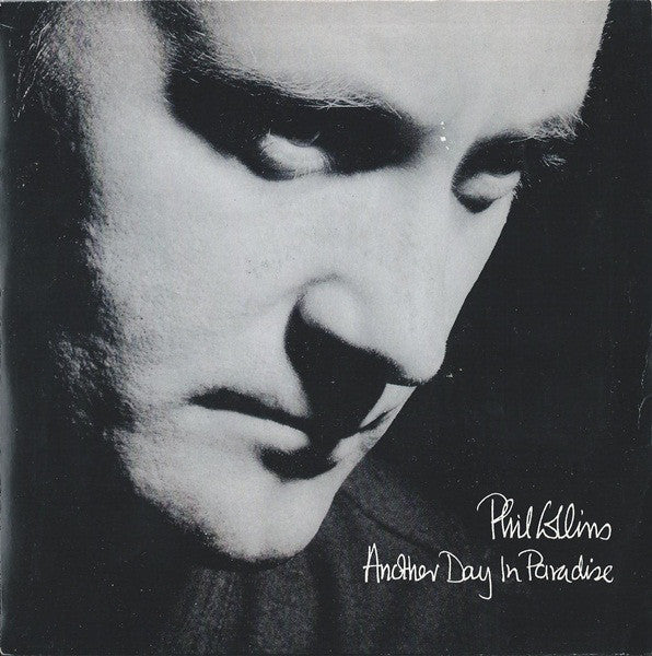 Phil Collins : Another Day In Paradise (7", Single, Pap)