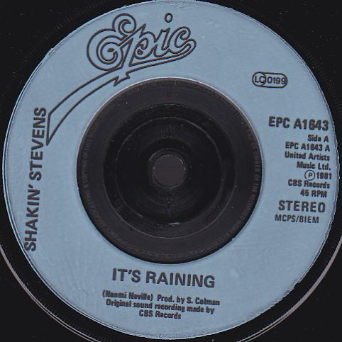 Shakin' Stevens : It's Raining (7", Single, Blu)