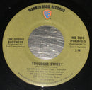 The Doobie Brothers : Listen To The Music (7", Single)