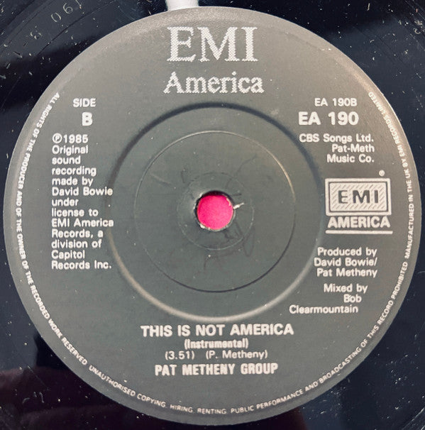 David Bowie / Pat Metheny Group : This Is Not America (Theme From The Motion Picture, The Falcon And The Snowman) (7", Single, Bla)