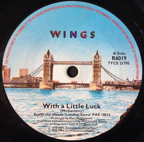 Wings (2) : With A Little Luck (7", Single, Sol)