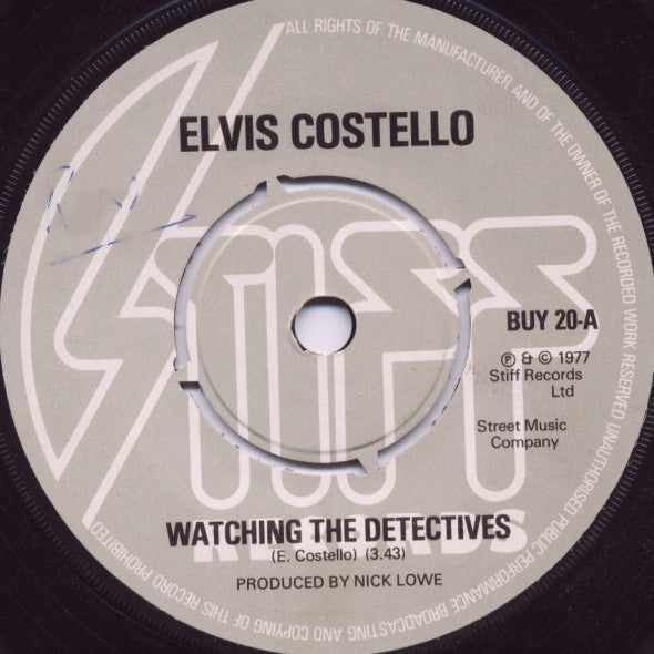 Elvis Costello : Watching The Detectives (7", Single, Pus)